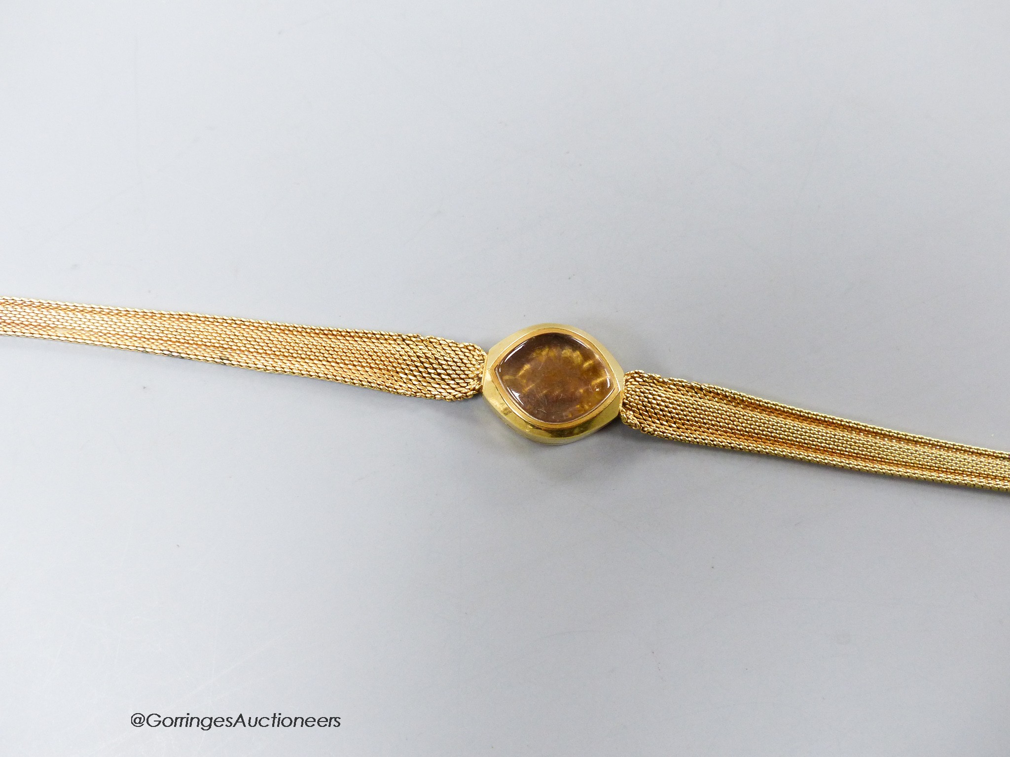 A lady's yellow metal (stamped 585) wrist watch case and strap (no movement), gross 14.6 grams.